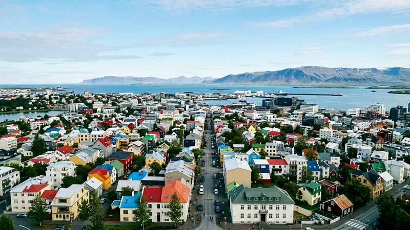 Colorful rooftops of Reykjavik old town seen from above with bay beyond